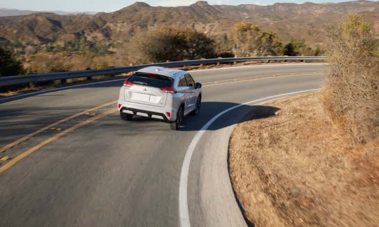 2026 Mitsubishi Eclipse Cross driving on curved road