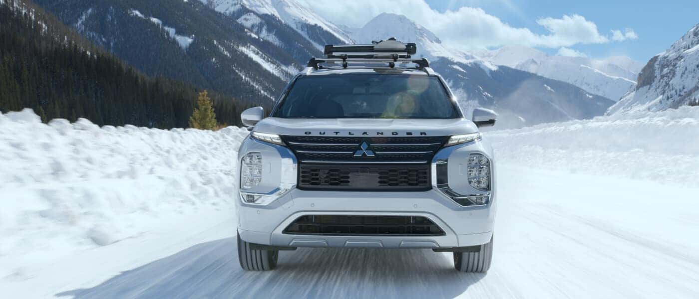2025 Mitsubishi Outlander PHEV Exterior Driving In Snow Head On