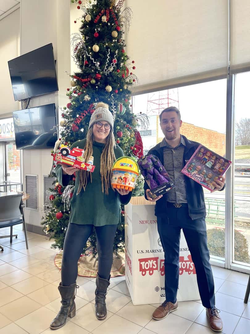 Toys For Tots with 2people standing
