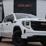 A White GMC Sierra 1500 in front of Oakes GMC in Kansas City, MO.