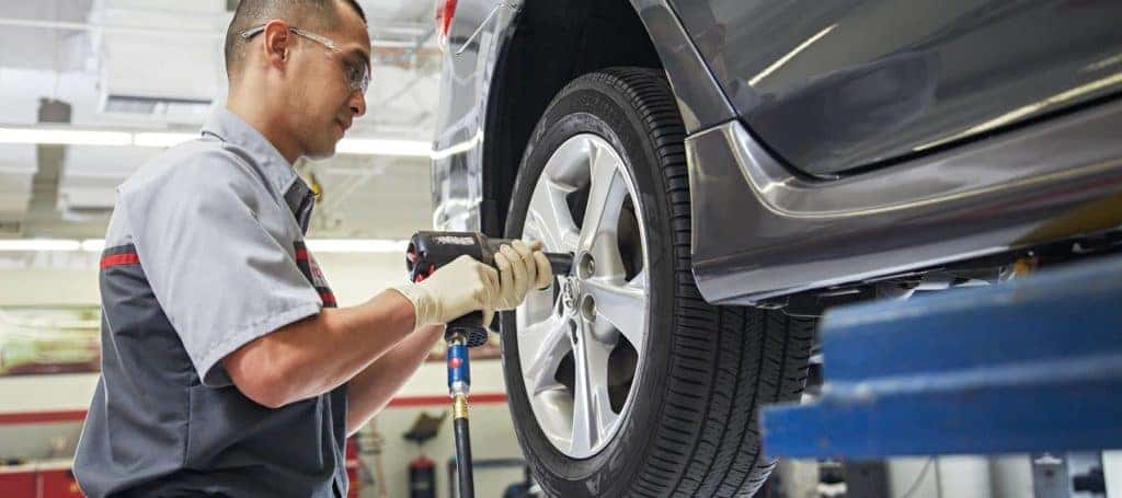 technician changing tire