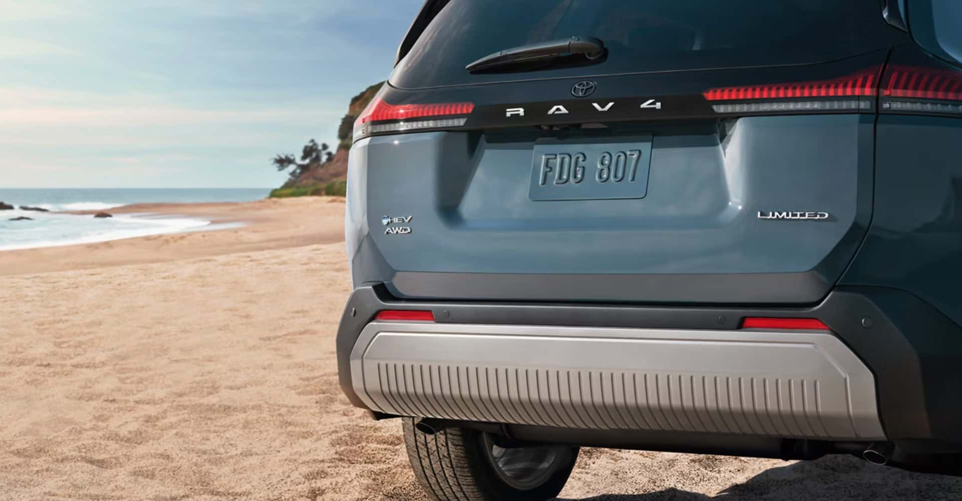 2026 Toyota RAV4 on beach in blue color
