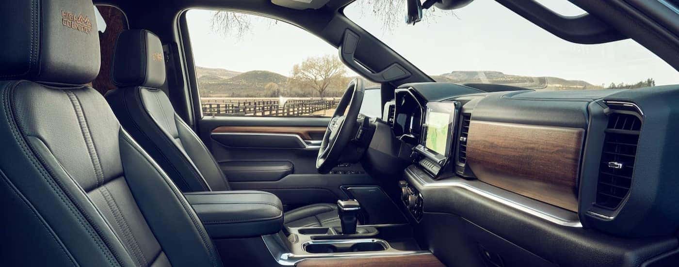 The black and brown interior and dash are shown in a 2025 Chevy Silverado 1500 High Country.