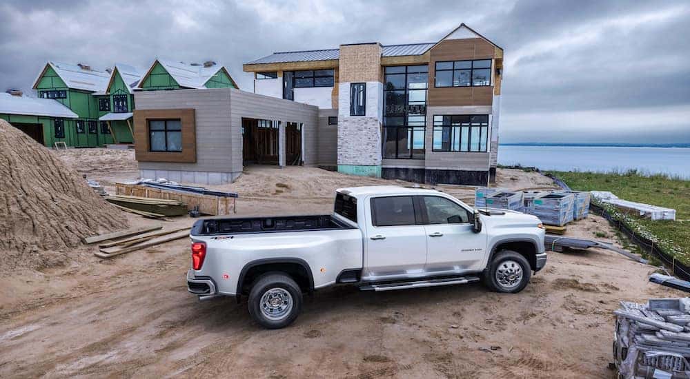 A white 2025 Chevy Silverado 3500 parked on a construction site.