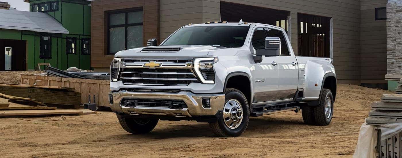 A white 2025 Chevy Silverado 2500 HD parked and angled left.