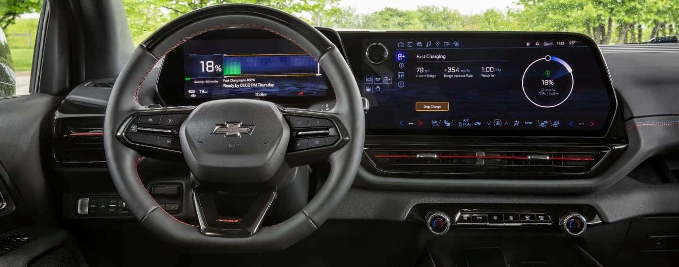 A close-up shows the fast charge function on the infotainment screen in a 2024 Chevy Silverado EV RST.