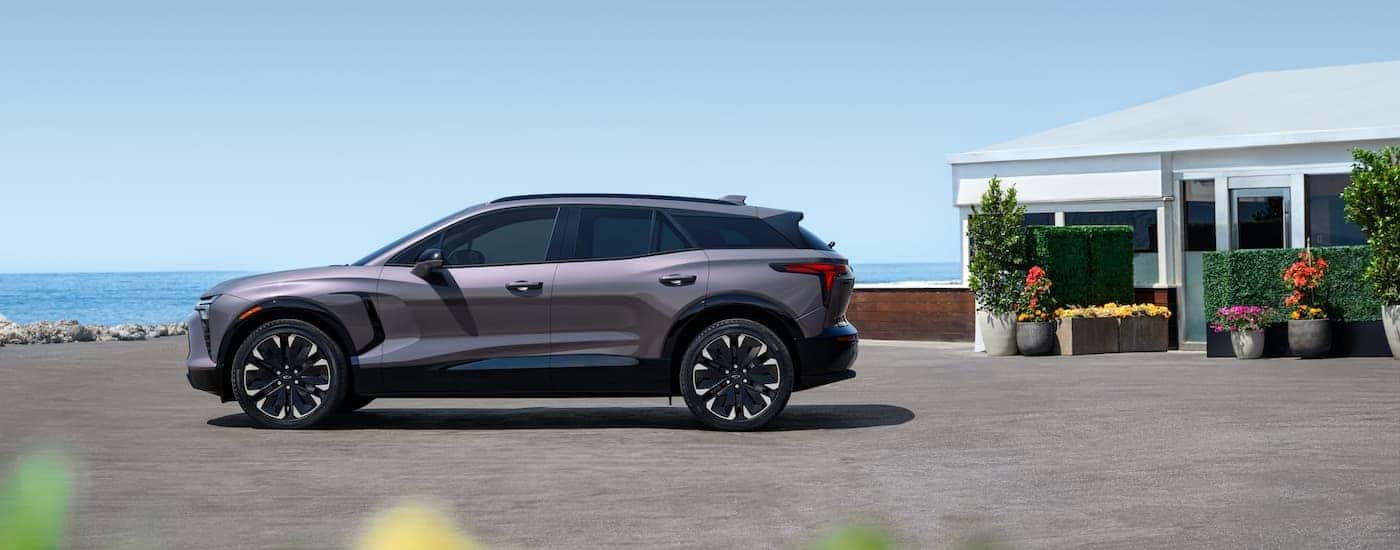 Side angle view of a parked grey 2025 Chevy Blazer EV.