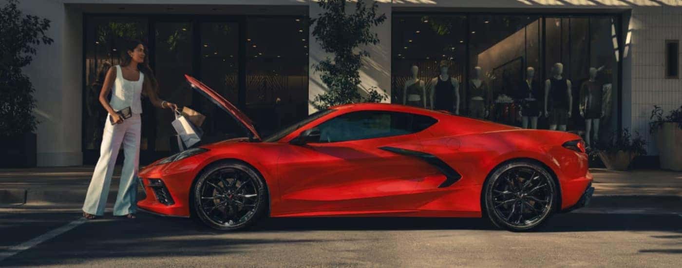 A person near a red 2025 Chevy Corvette Stingray after leaving a Chevy dealer near Albemarle.