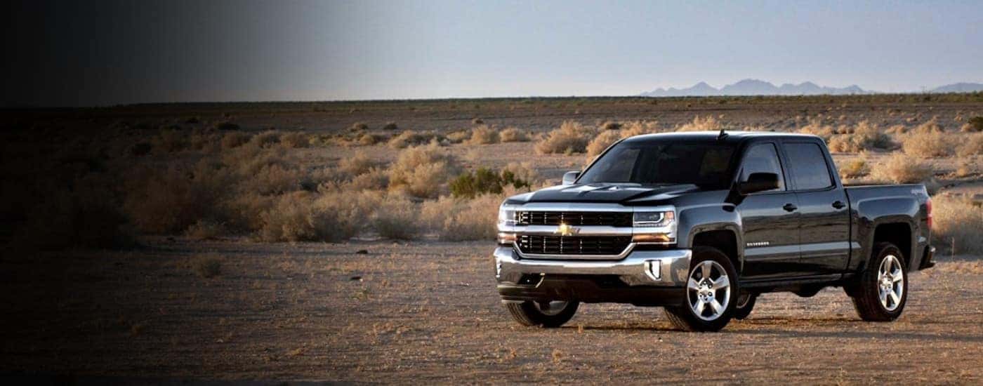 A black 2017 Chevy Silverado 1500 parked off-road.