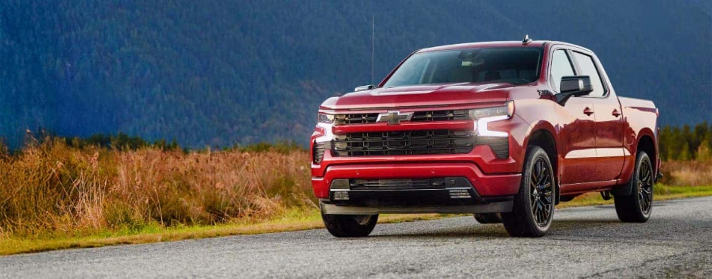 A red 2015 Chevy Silverado 1500 for sale near Kannapolis on a trail.