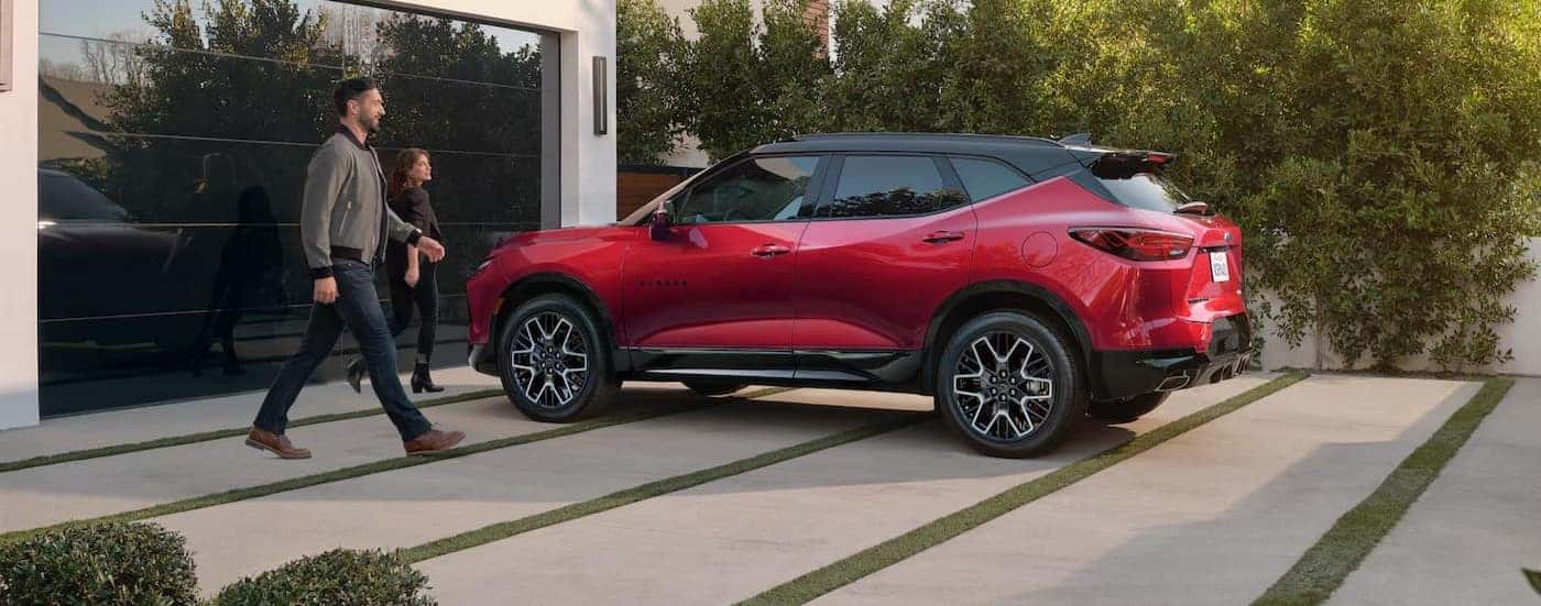 A red 2025 Chevy Blazer RS for sale parked on a driveway.