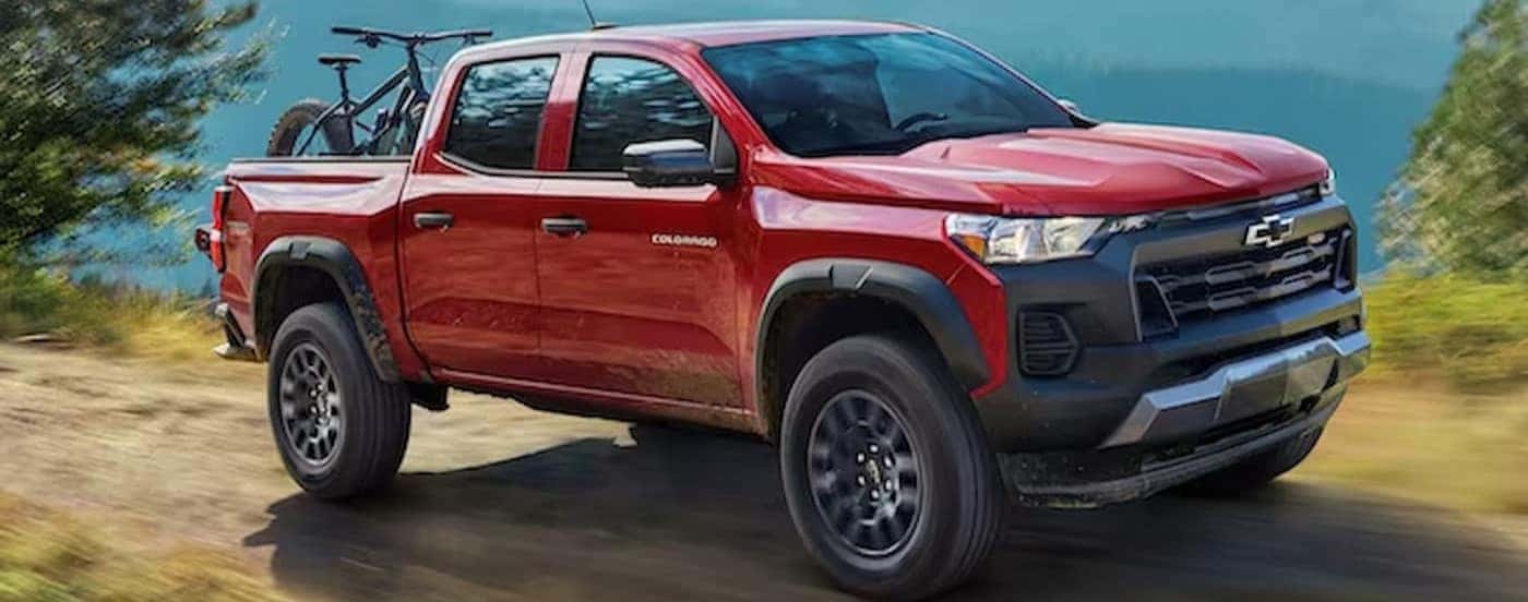 A red 2024 Chevy Colorado Trail Boss off-roading.