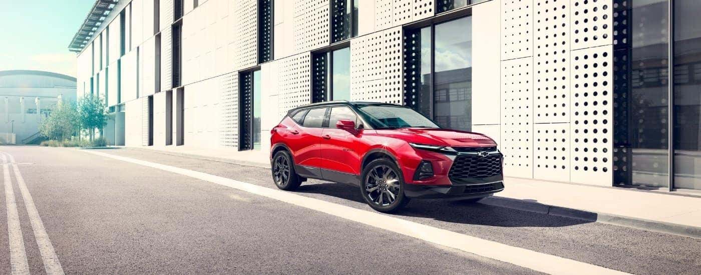 A red 2025 Chevy Blazer from the front at an angle.