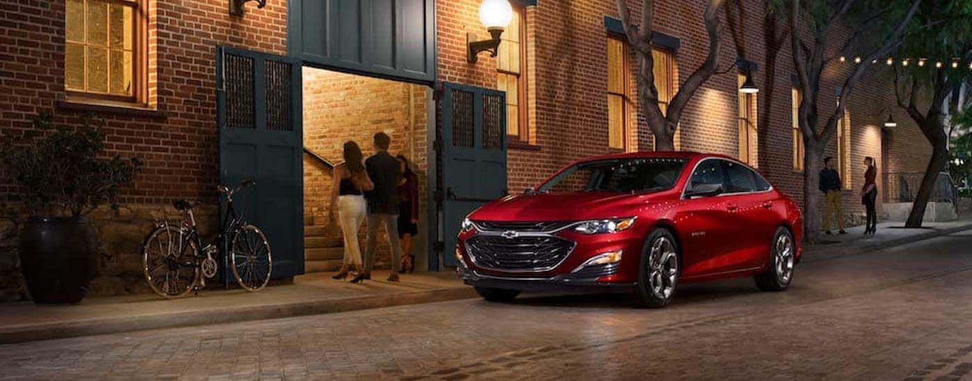 A red 2019 Chevy Malibu from the front at an angle.