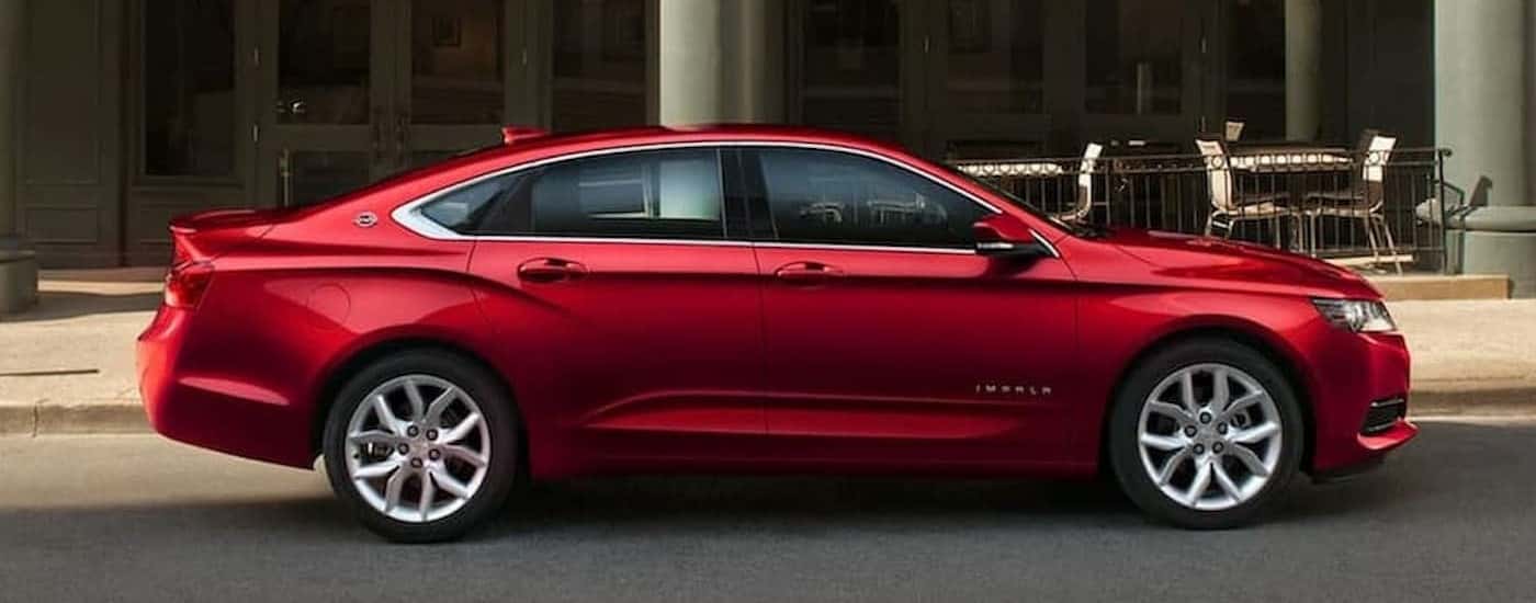 A red 2020 Chevy Impala parked after viewing a used Chevy for sale near Gastonia.
