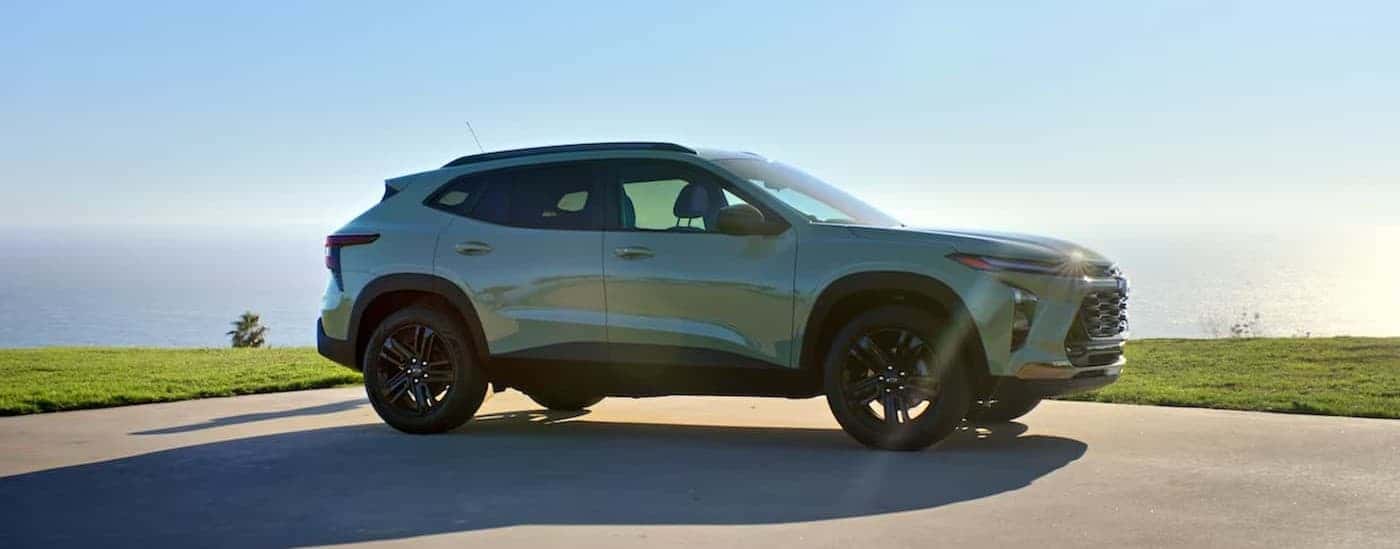 A green 2024 Chevy Trax parked on a parking lot.