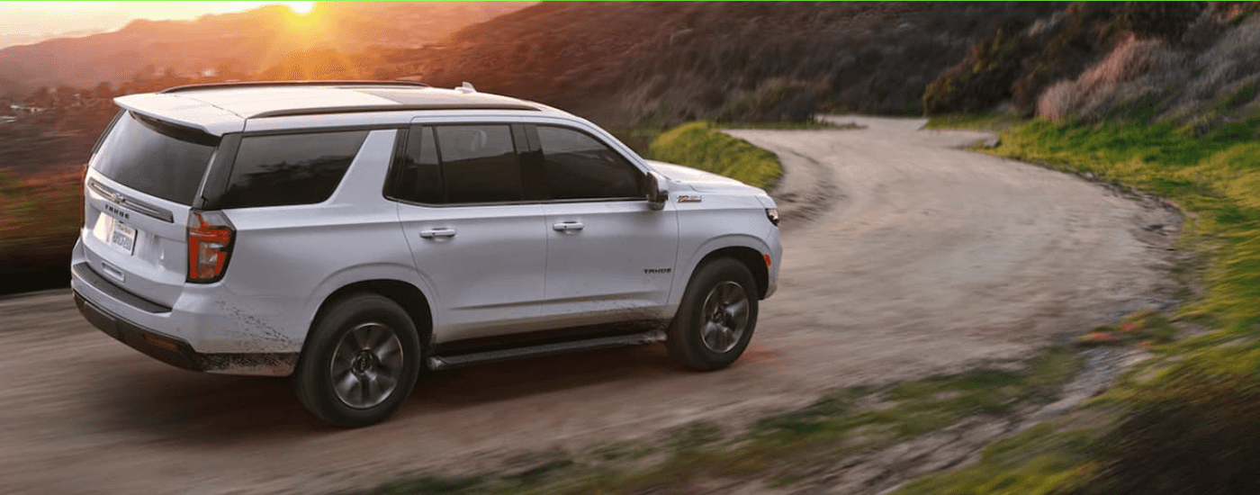White 2021 Chevy Tahoe Z71 driving down a trail