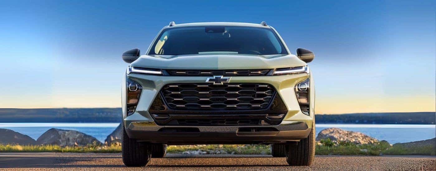 Green 2024 Chevy Trax parked near a lake