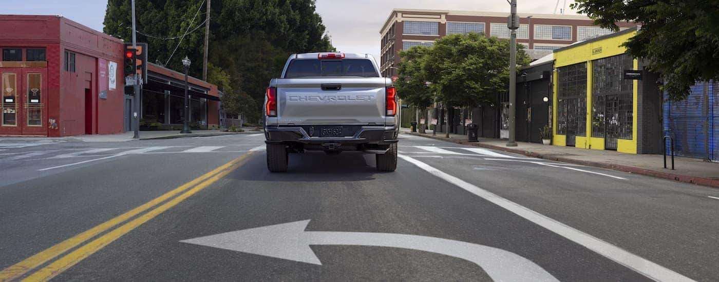 A silver 2023 Chevy Colorado from the rear.