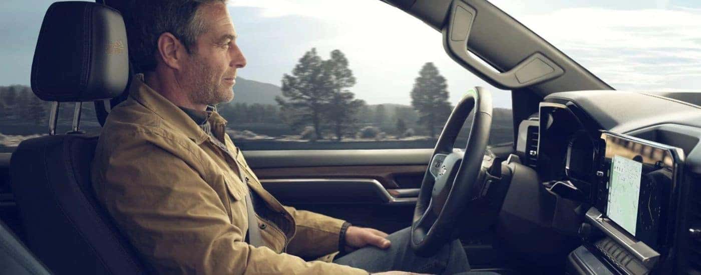 A man using Super Cruise inside a 2026 Chevy Silverado 1500