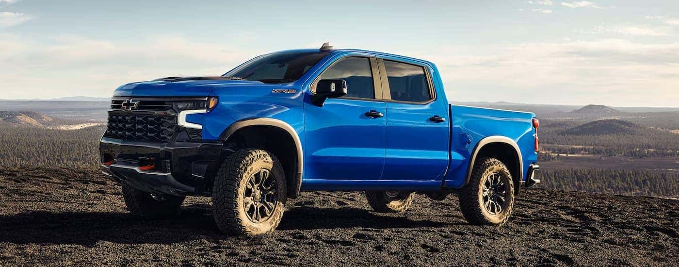 A blue 2025 Chevy Silverado 1500 ZR2 parked off-road