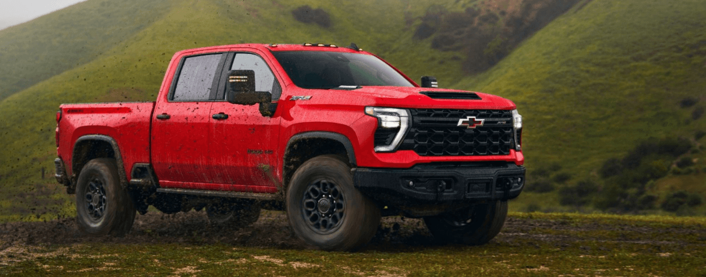 Red 2026 Chevy Silverado 2500 HD ZR2 Bison parked off-road