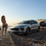 The 2021 Porsche Macan parked by the water towing a jet ski.