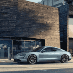 A silver 2022 Porsche Taycan charging in the Los Angeles area.