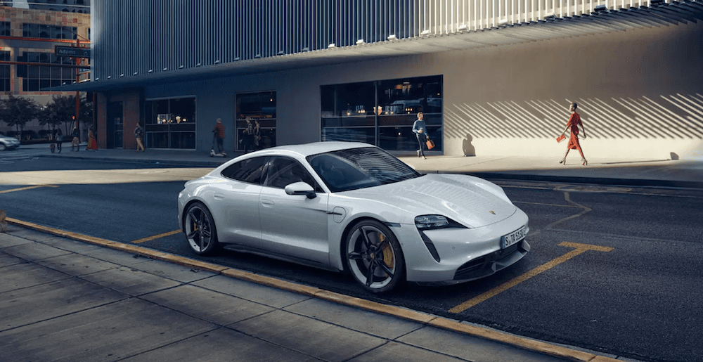 White 2023 Porsche Taycan Parked on side of road showing side view of vehicle