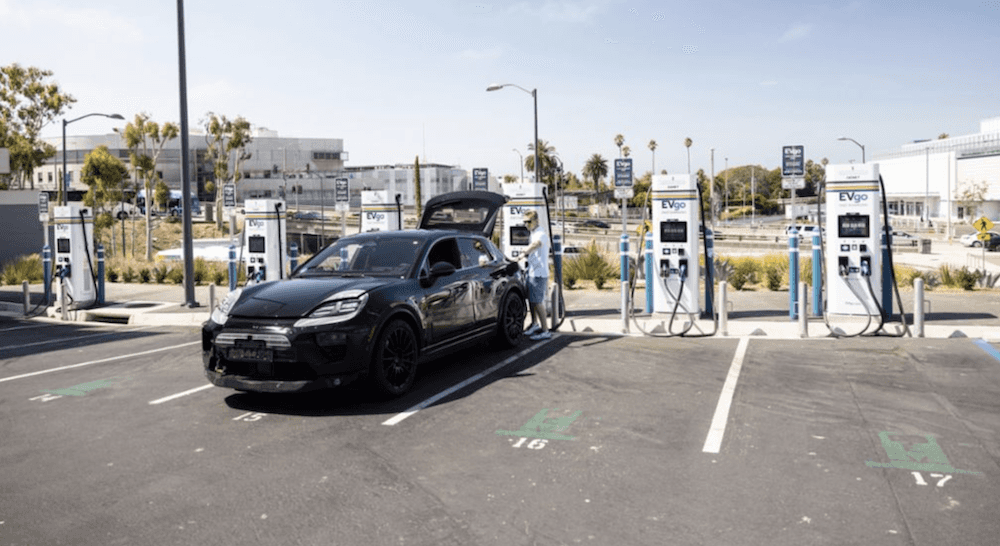 Electric Porsche Macan at charging station