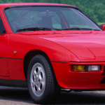 Red Classic Porsche 924 parked on road