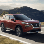 2023 Nissan Rogue driving on road