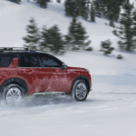 Nissan Pathfinder driving through snow