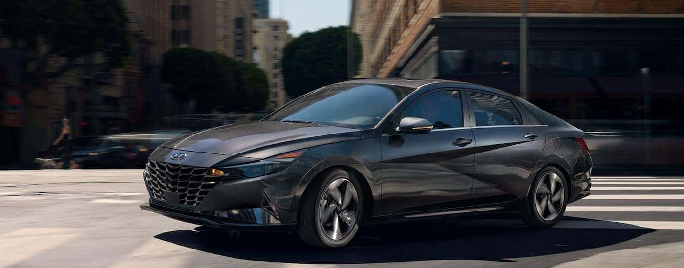 A grey 2022 Hyundai Elantra driving to a used car dealer near Alcoa.