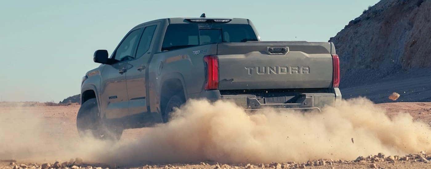 A grey 2022 Toyota Tundra TRD Off-road is shown from the rear at an angle.