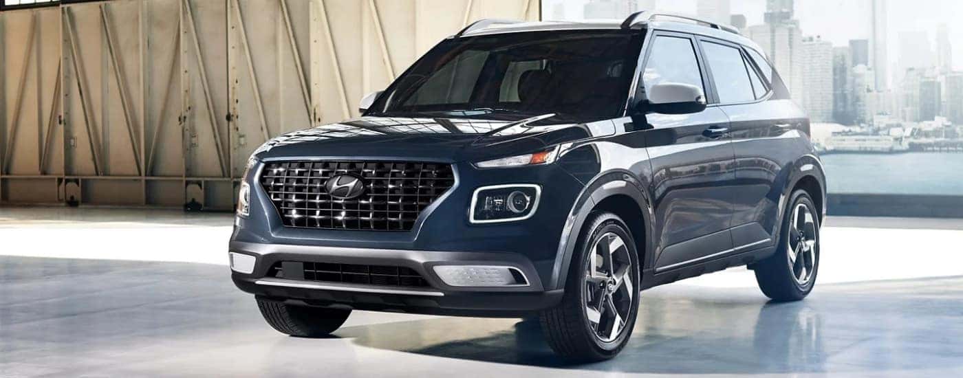 A grey 2022 Hyundai Venue is shown from the front at an angle.