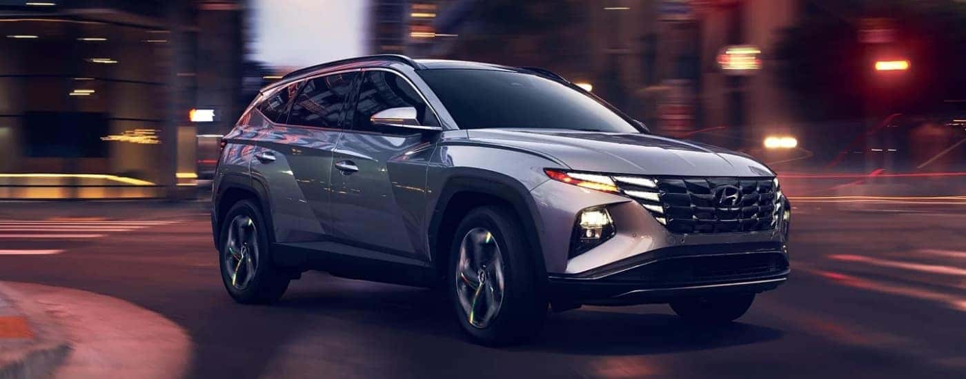 A silver 2022 Hyundai Tucson is shown from the front at an angle after leaving a used Hyundai dealer.