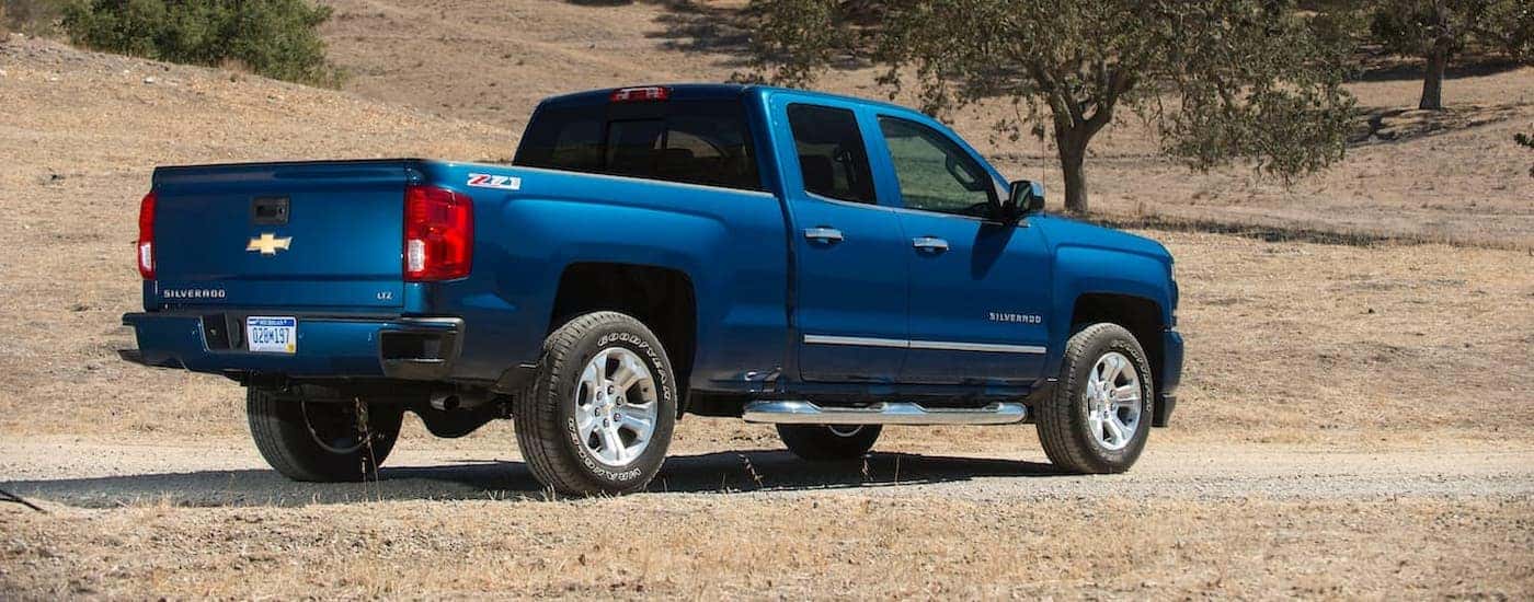 A blue 2018 Chevy Silverado 1500 Z71 is shown parked off-road.
