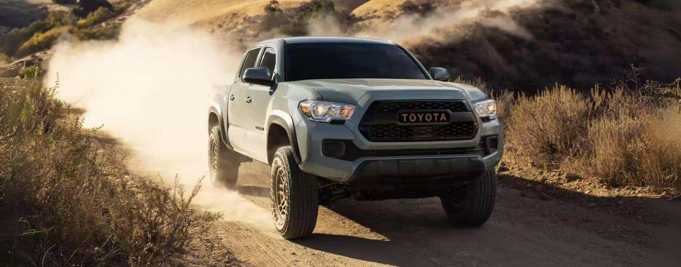 Greed 2023 Toyota Tacoma SR5 Trail Edition driving down a dusty road