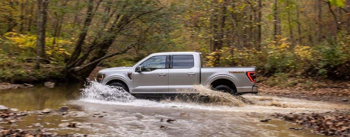 A silver 2021 Ford F-150 Tremor is shown from the side.