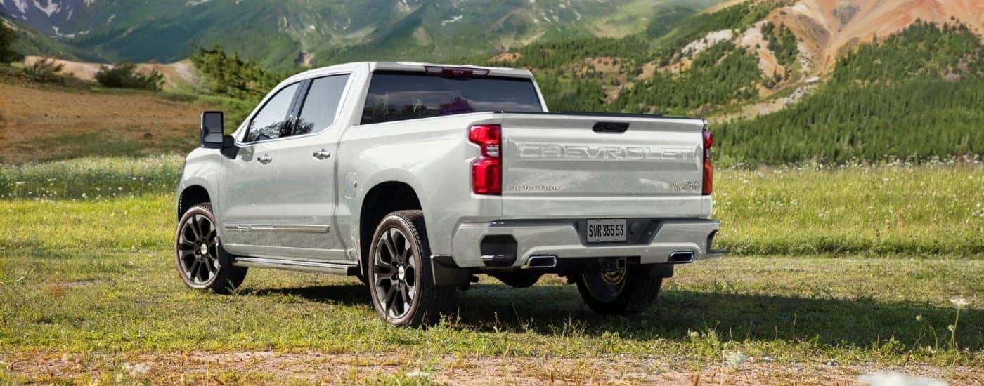 A white 2023 Chevy Silverado 1500 is shown from the rear after leaving a dealer that has used cars for sale near Norris.