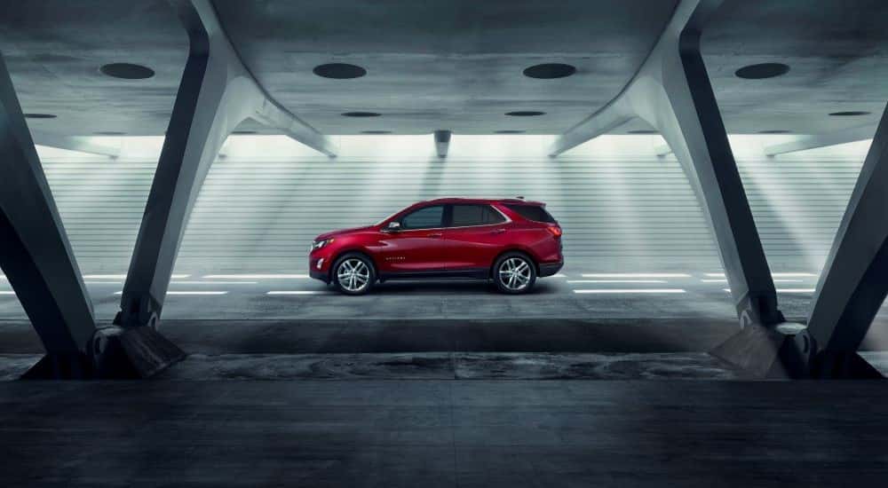 A red 2018 Chevy Equinox driving in a tunnel.