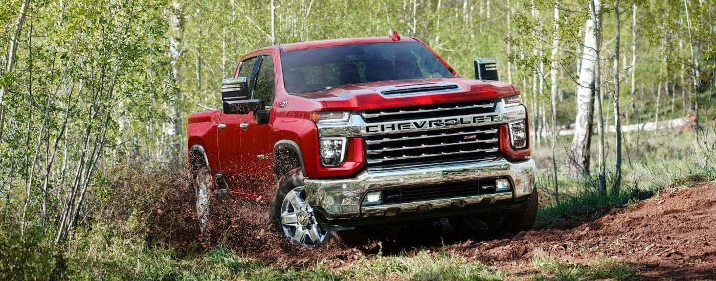 A red 2022 Chevy Silverado 2500 from the front while off-road.