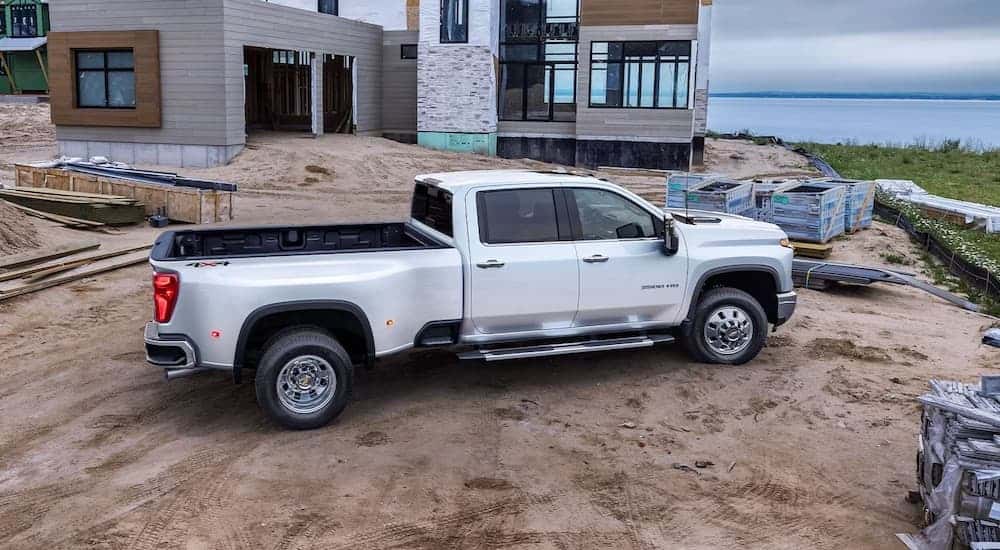 A white 2023 Chevy Silverado 3500 from the side.