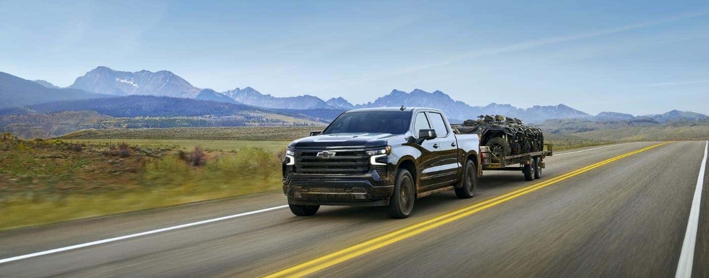 A black 2023 used Chevy Silverado 1500 for sale from the front.