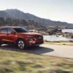 A red used 2019 Hyundai Santa driving down the road