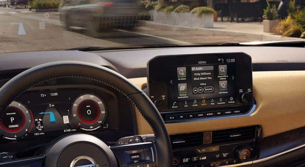 Infotainment and digital gauge cluster on a used 2021 Nissan Rogue for sale
