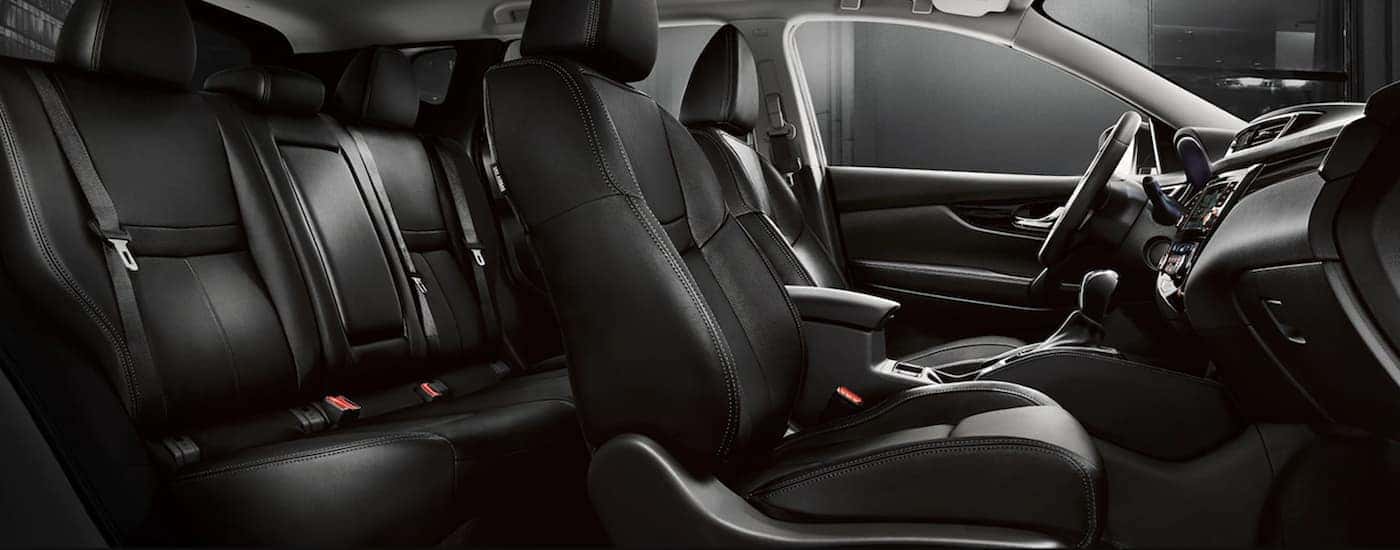 Black leather interior of a Used 2021 Nissan Rogue Sport