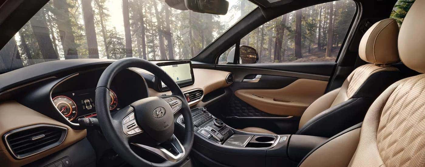 Cream and black interior of a used 2023 Hyundai Santa Fe for sale