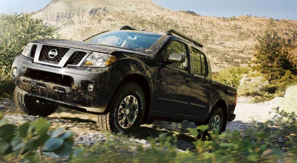 A black 2019 Nissan Frontier PRO 4X off-roading